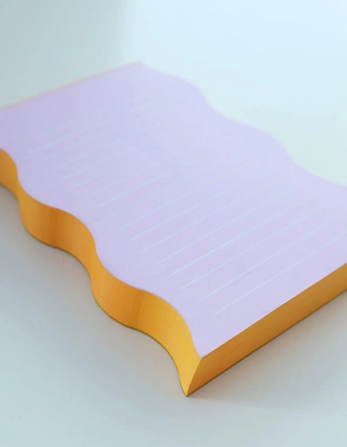 Bloc-notes à bord ondulé – Lilas et contour tangerine
